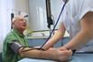 A man having his blood pressure tested