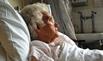 Elderly woman in hospital bed