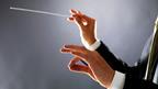 Music conductors hands with baton