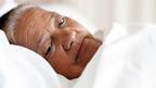 Elderly woman in bed