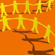 Paper cut outs of hand-holding people