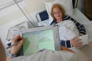 Mobile tablet being used in hospital to take patient record notes
