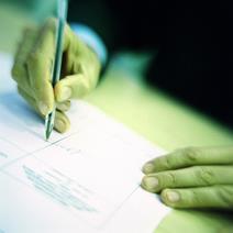 A contract being signed with a pen