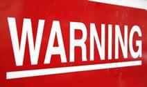 A red sign saying warning