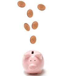 Piggy bank with coins flying into it