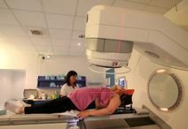 A woman having a cancer radiotherapy scan