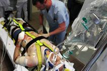 Man being admitted to accident and emergency from ambulance