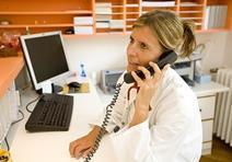 A doctor on the phone to a patient