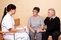 nurse talking to two patients