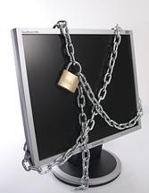 A computer screen locked with a chain