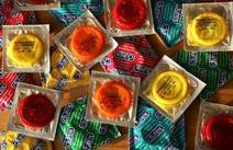 A lot of different coloured condoms