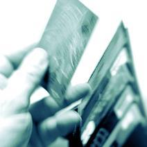 Credit Cards being pulled out of a wallet