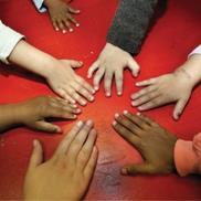 Children's hands in a circle