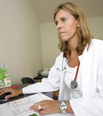 Doctor using a desktop computer