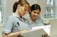 A student nurse and mentor discussing work