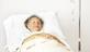 Older woman in hospital bed