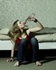 Young girl drinking alcohol from the bottle