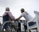 Older patient in wheelchair with social care worker