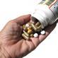 Pills being poured into a hand