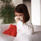 child blowing her nose