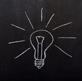A lightbulb drawn on a chalkboard