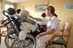 Care Home nurse helping an elderly patient to drink