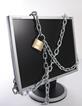 A computer screen with a chain and padlock around it