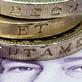 Coins stacked on top of note
