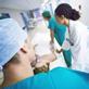Hospital staff admitting patient to hospital on trolley