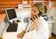 A doctor on the phone to a patient