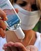 Nurse cleaning her hands with antibacterial handwash at hospital
