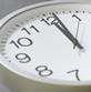 A clock face showing one minute past 12