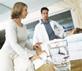 Doctor and nurse visit patient bedside in hospital