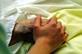 Older person's hand being held