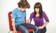 Woman injecting boy with an anaphylaxis autoinjector