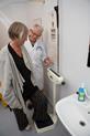 Doctor giving a female patient physical health check