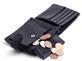 Coins spilling out of leather wallet