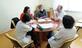 Group of people sitting round a table