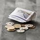 Wad of notes and coin money