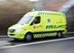 Ambulance racing along road