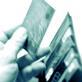 Credit Cards being pulled out of a wallet