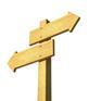 Wooden sign post showing different directions