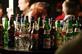 A pub table full of empty alcohol bottles