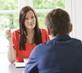 Two people having a cross table discussion
