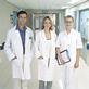 Nurse and doctors in hospital corridor