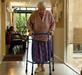 Older woman using zimmerframe