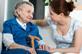 Community services care worker with elderly woman patient